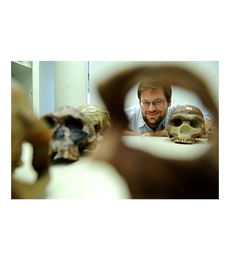 Professor Bence Viola with a Collection of Skulls