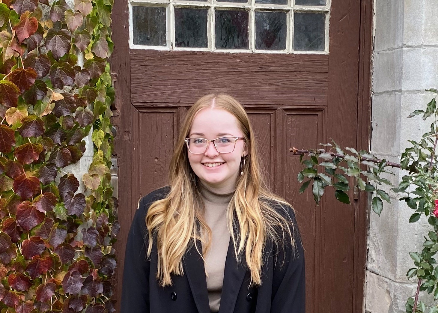 Karyn Anderson in front of door