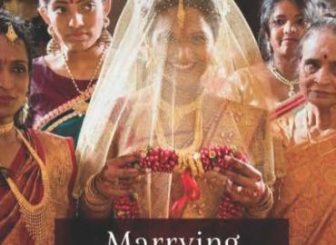 Poster featuring a bride smiling through a veil