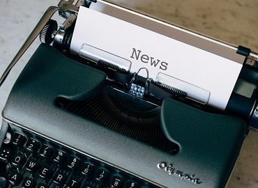 A piece of paper with the word &amp;quot;News&amp;quot; protrudes from a typewriter